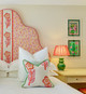 Tasha's Trip Hot Pink on a headboard and cushion